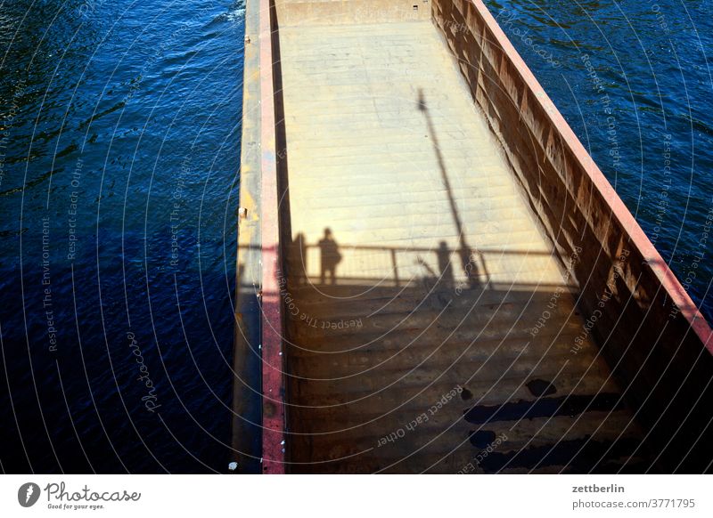 Shadows in the empty towing unit ship Navigation Harbour Channel Water River Motor barge Barge Empty Sun Summer holiday Transport logistics people bridge