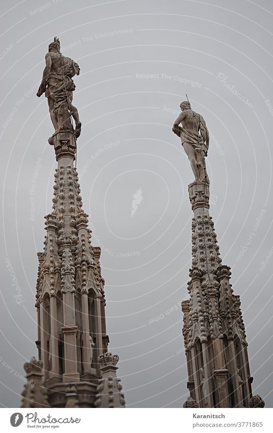 Filigree lace and turrets with stucco work and figures on the roof of the Milan Cathedral. Sky Gray sharpen tower Tower Work of art Architecture Dome Church