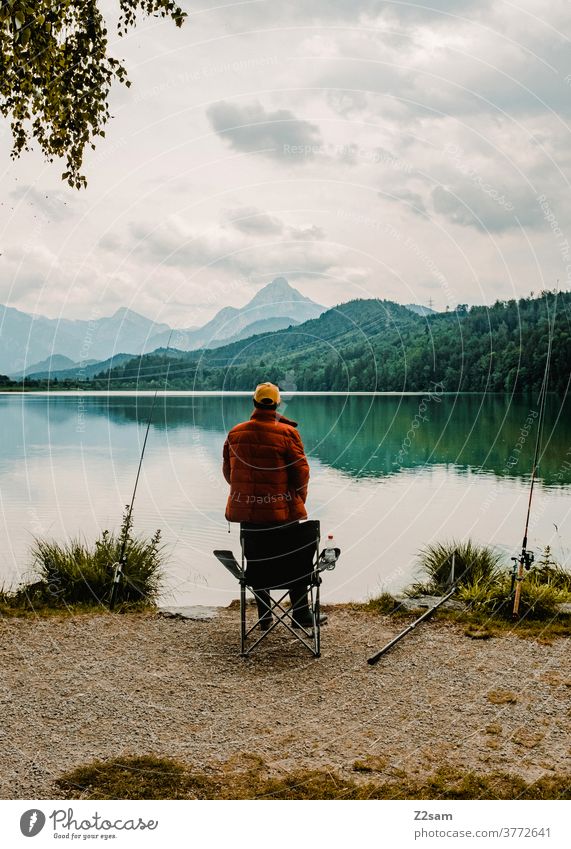 Fishermen at the lake Allgäu Lake Fisherman Mountain Nature Landscape Exterior shot Alps Water Colour photo Sky Deserted Peak Environment Lakeside fishing rods