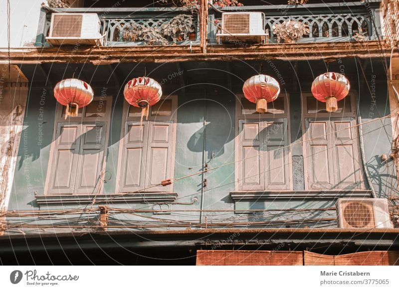 Chinese lanterns hanging on old historic buildings in the heritage site of Yaowarat Road or Chinatown in Bangkok City heritage town yaowarat road chinatown