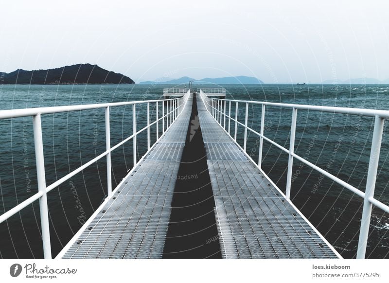 White boat jetty reaching into the sea, Naoshima, Japan naoshima ocean water wave coast sky bay beach horizon islet landscape shore japan melancholy daytime