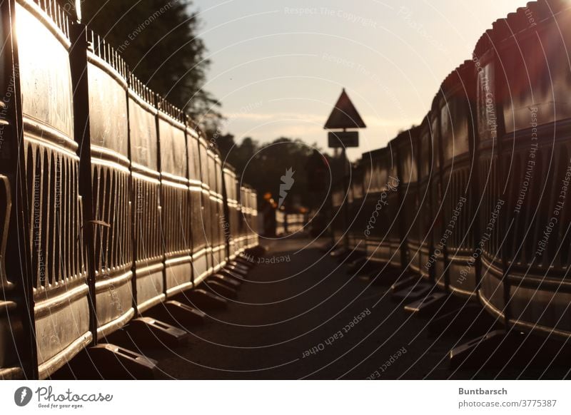 Path through building barriers in backlight construction cordon Protective Grating Construction site cycle path Lanes & trails Narrow lattice fence site fence