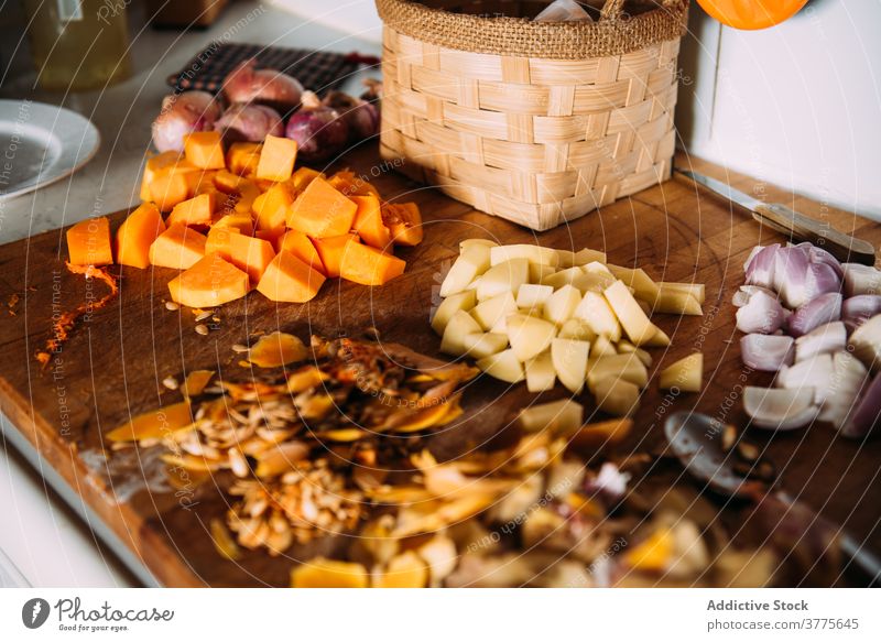 Chopped ingredients for cream soup recipe on table vegetable cook chop cut various pumpkin potato food onion assorted fresh kitchen prepare cuisine culinary