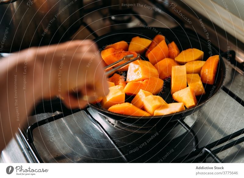 Housewife preparing pumpkin for soup cook prepare stew vegetable ingredient food kitchen housewife add woman cuisine recipe culinary homemade vegetarian natural