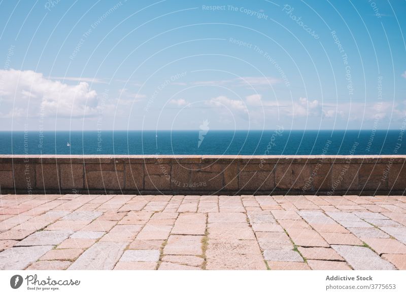 Empty paved embankment near sea seaside sky waterfront pavement coast stone border ocean empty spain cape vilan galicia costa da morte shore travel tourism