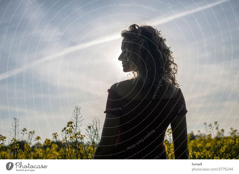 happy young woman in a rape field, silhouette Woman Happy sensual fortunate daintily Canola Joy Silhouette Canola field Smiling Laughter pretty Dress