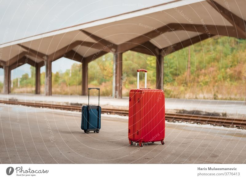 two travel suitcases, luggage bags on train station, travel concept architecture baggage building business city color covid green no people no tourists old