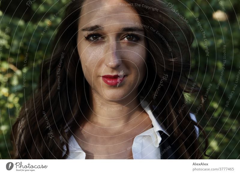 Portrait of a young woman with light and shadow play in the forest portrait Woman already Near fit daintily Skin Face Blonde look Direct Long-haired Slim