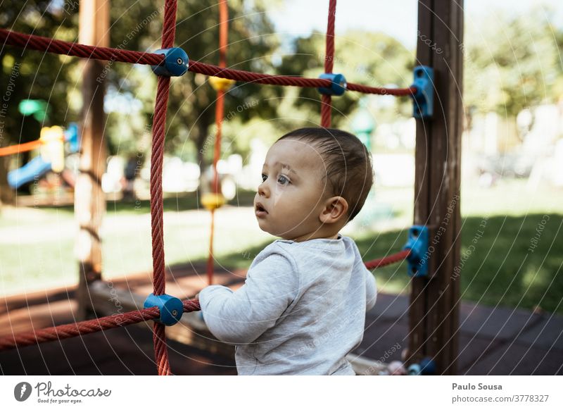 Toddler playing in the playground Playing Playground Park Kindergarten 1 - 3 years Leisure and hobbies Human being Colour photo Joy Child Exterior shot Day