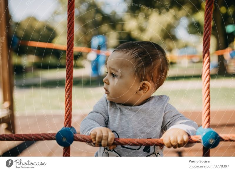 Toddler playing in the playground Child Children's game Kindergarten Jungle gym 1 Day Parenting Exterior shot Playground Colour photo Human being Infancy