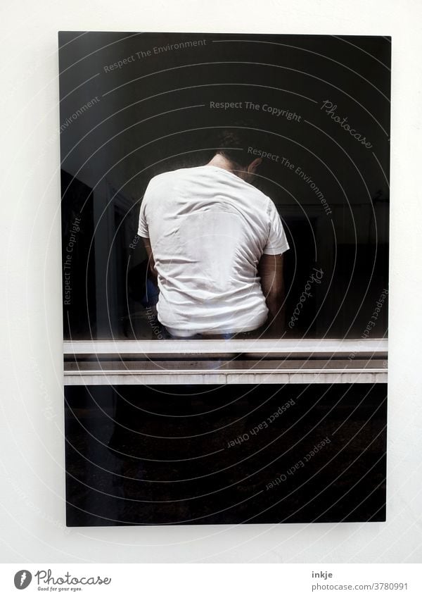 Isolated insulation Upper body Man dark background texture conceit Black White T.shirt behind Pane Sit Crouch Wait Loneliness on one's own one man alone centred