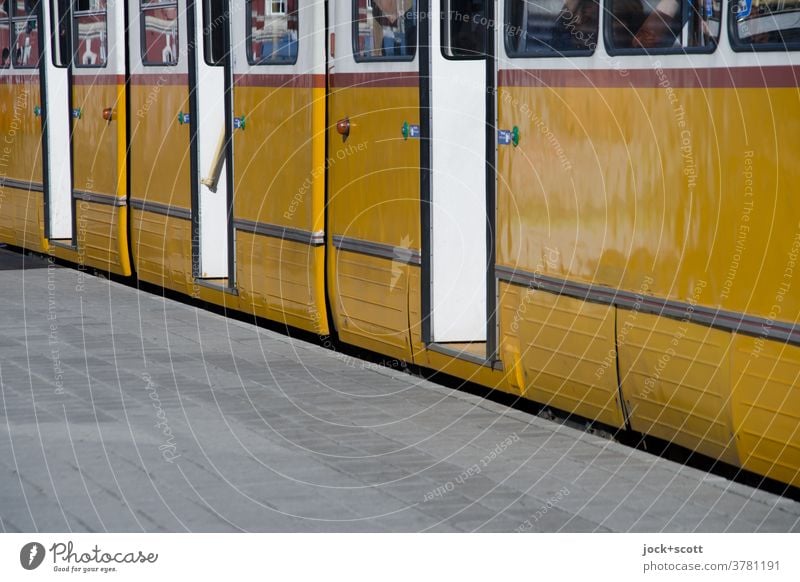 Tram has just stopped at the stop Stop (public transport) Doorframe Retro Mobility Open Public transit Means of transport Dependability Arrival Platform