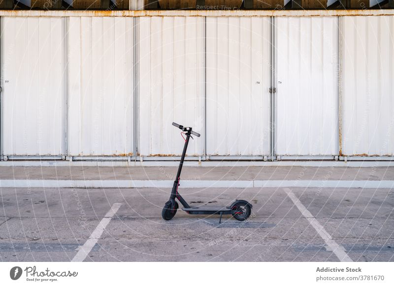 Electric scooter on parking lot electric scooter transport urban vehicle alternative eco friendly ride modern equipment commute machine facility object parked