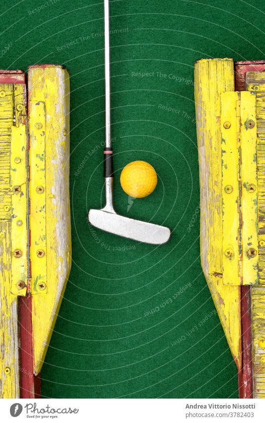 close up on a minigolf ball on the course with copy space for your text outdoor outside no people nobody color image fine art print wall print play playing fun