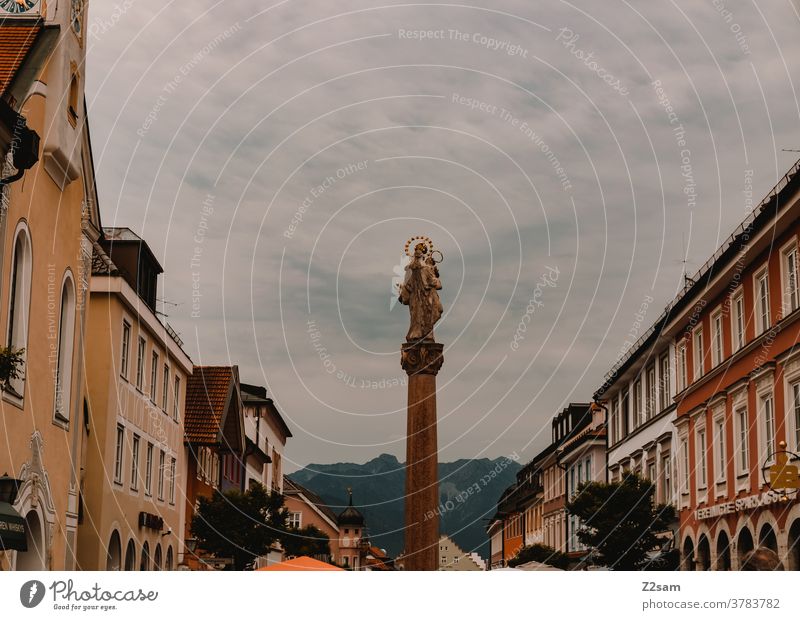 Murnau / City centre Bavaria Town mountains Alps downtown urban Small Town Landmark Well Statue houses Pedestrian precinct Sky cloudy Historic Architecture