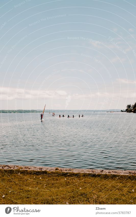 Surf school Starnberger See Aquatics Water Lake reflection Reflection Sports Movement Relaxation tranquillity relaxation bathe Lake Starnberg Clouds Blue