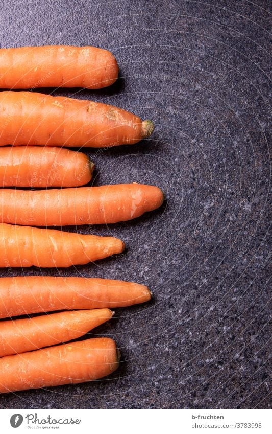 Carrots or carrots on kitchen plate Vegetable yellow beet Vegetarian diet Food Healthy Organic produce Fresh Healthy Eating Nutrition Vegan diet cake