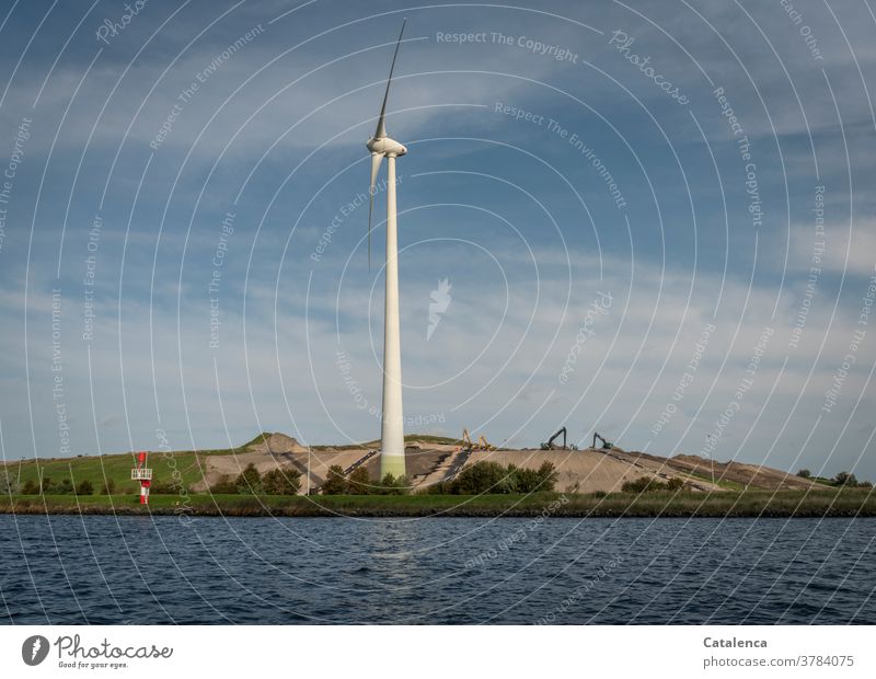 Wind turbine and construction site at the North Sea Canal Clouds Sky Channel Sustainability wind power Renewable energy shipping Water Wet Pinwheel Excavator