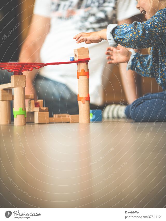 playing together child with grandpa Playing Child Toys fun Friends Enthusiasm Marbles Girl Cute Father