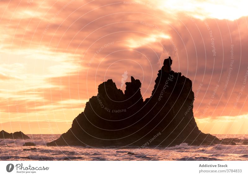 Amazing scenery of sea in evening seascape sunset orange vibrant rock mountain shore sky amazing tenerife spain canary islands water picturesque vacation ocean