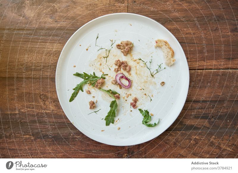 Empty plate after Steak tartare on table dirty empty steak tartare delicious wooden home messy tableware kitchen kitchenware dish yummy culinary dishware