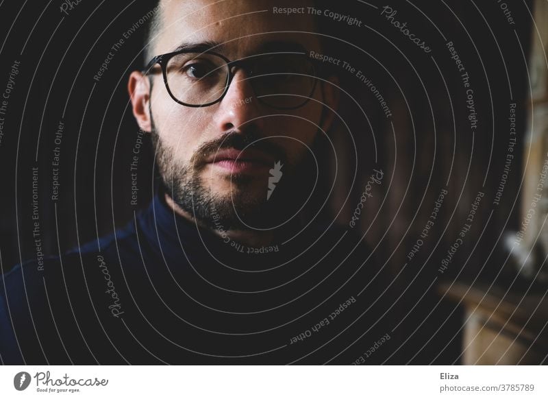 Portrait of a dark-haired man with glasses and beard. Serious look into the camera. Man Earnest Dark-haired Facial hair Eyeglasses Looking into the camera