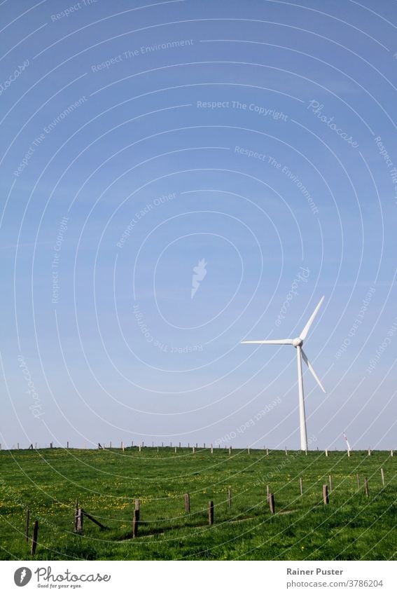 Wind turbine on a hill - harmony between technology and nature alternative blue clean climate copy space ecology electric electricity energy environment