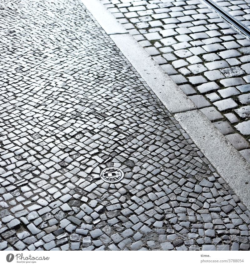 Paving stone and iron layer off stones Sidewalk Traffic lane urban Transport Town Back-light measuring point Cobblestones heel sealed shine reflect Handcrafts