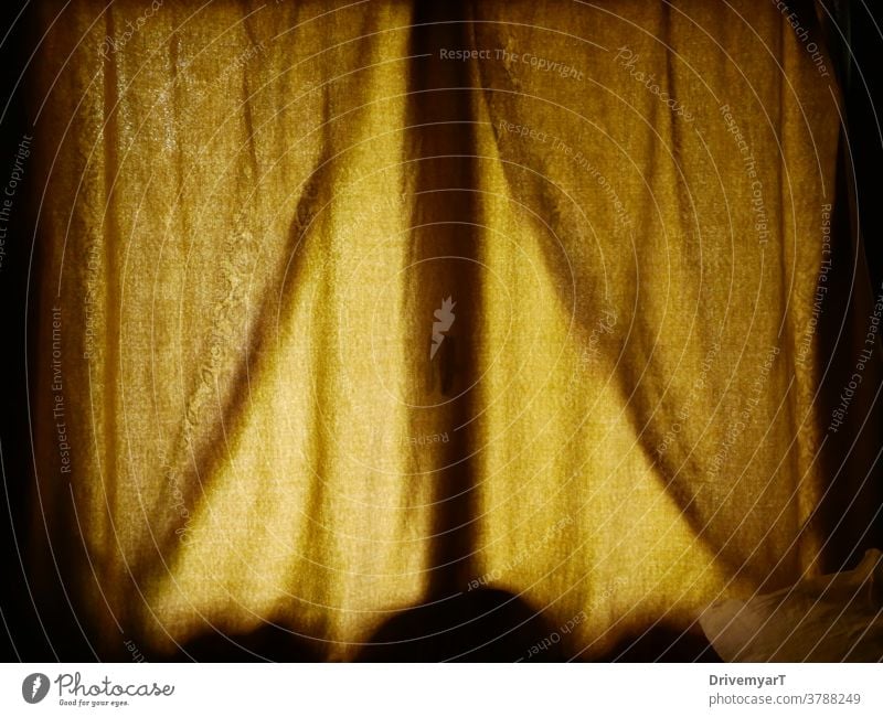 Yellow curtains in front of a window with light from the outside yellow room bedroom fabric pattern texture rough surface shade nuance atmosphere ambiance