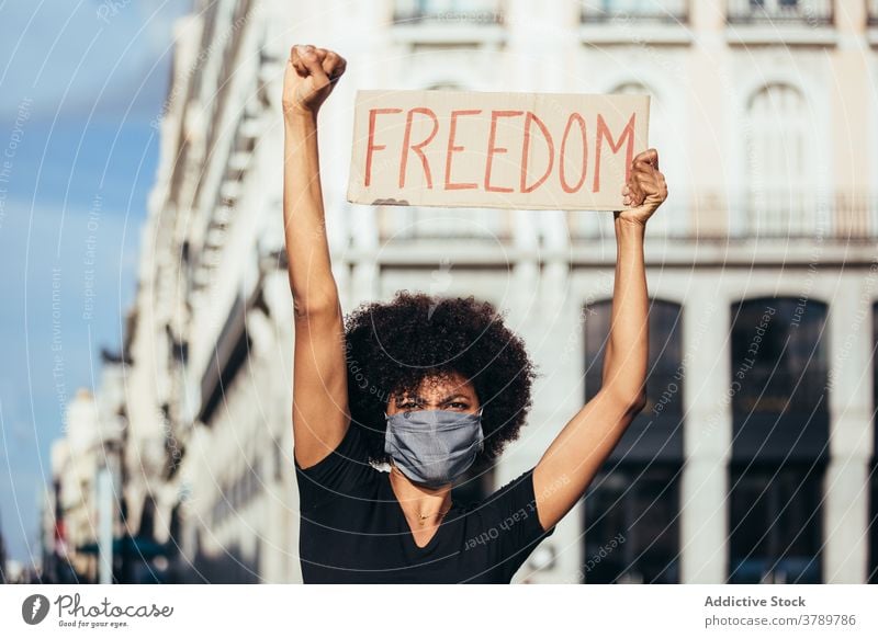 Black afro woman on demonstration against police brutality protest people black racism violence lives social justice black lives matter sign american activism