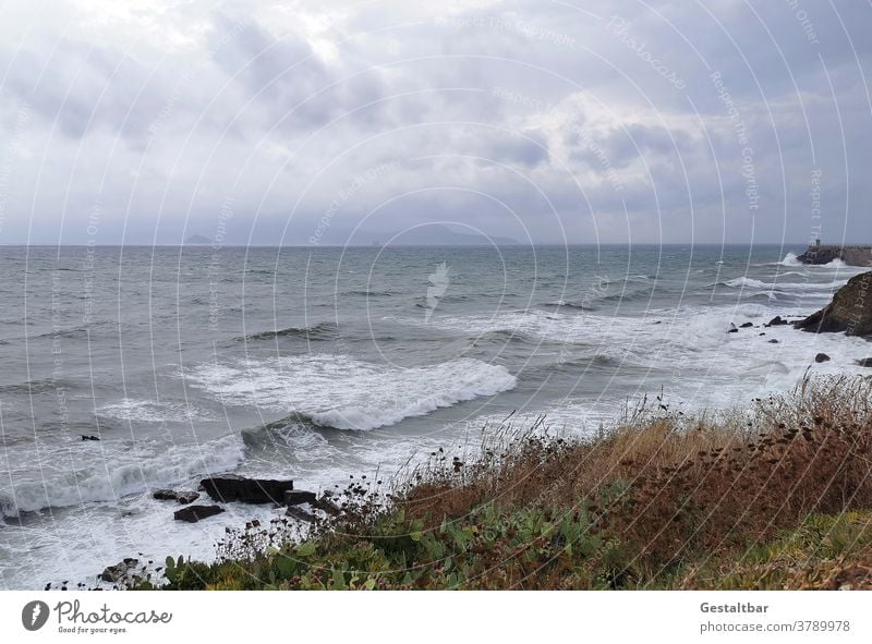 View of the island of Elba Island Swell Beach Ocean Mediterranean sea Clouds windy stormy Rock piombino Italy vacation