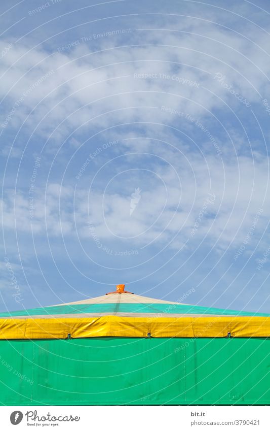 Colourful roof of the circus tent, in front of a blue sky. Circus Circus tent Tent Tarpaulin Roof tent roof copyspace copy space Copy Space Sky Blue sky Clouds