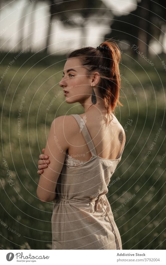 Tender red haired woman on meadow redhead tender tranquil grace nature sunlight appearance summer female iceland ice cream dress field sunny serene calm relax