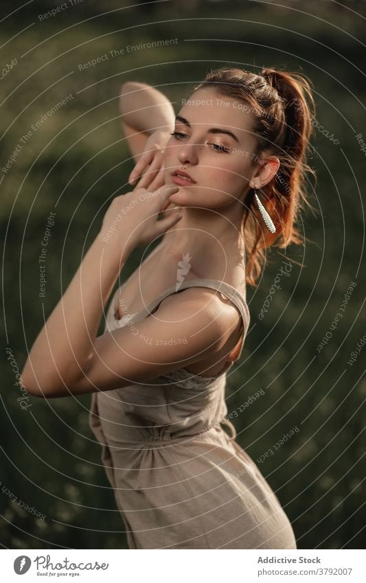 Tender red haired woman on meadow redhead tender tranquil grace nature sunlight appearance summer female iceland ice cream dress field sunny serene calm relax