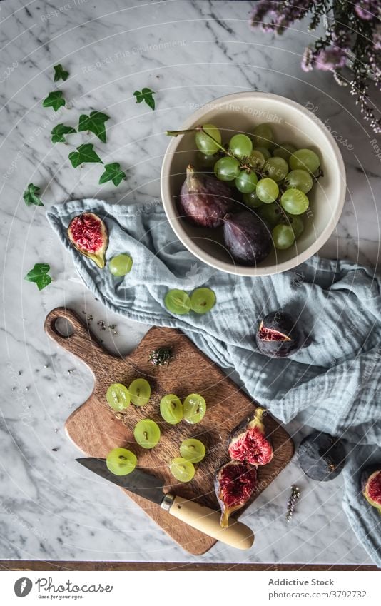 Tasty fruits on table at home arrangement grape fig kitchen sweet towel fresh vitamin healthy food marble delicious organic tasty nutrition natural meal