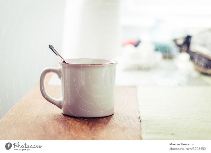 white cup of breakfast on wooden table simple empty clean coffee cup porcelain nordic scandinavian light design texture beverage modern cappuccino window food