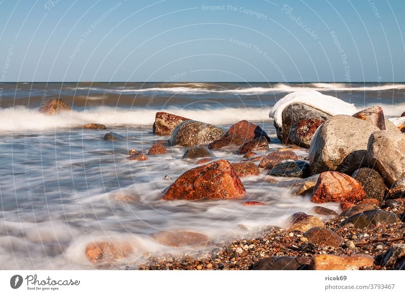 The Baltic Sea coast near Kühlungsborn in winter Beach stones Ocean Water Winter Snow Waves Ice Mecklenburg-Western Pomerania Baltic coast Sky Blue clear Nature