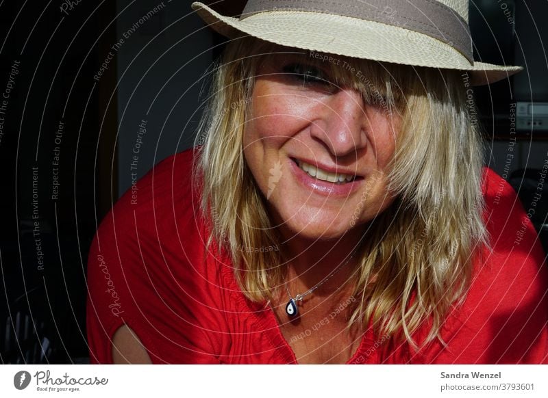 Woman with hat in sunlight Blonde hair Hat Sunlight Lowlight high aperture Laughter Teeth