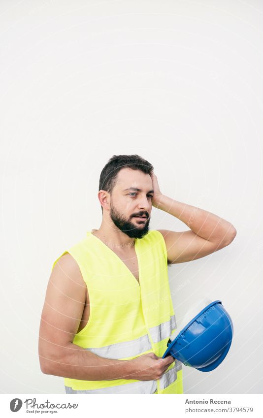 tired construction site builder with headache removes helmet man worker portrait arab middle eastern professional hardhat security isolated white background