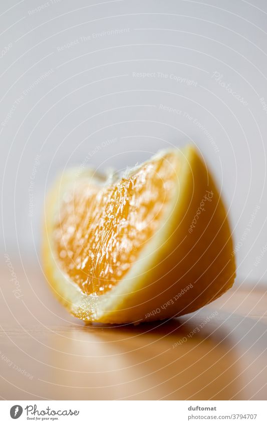 Macro shot of an orange slice on a table Orange Vitamin Nutrition Food Healthy Fruit Vitamin C Organic produce Vegetarian diet Healthy Eating Food photograph