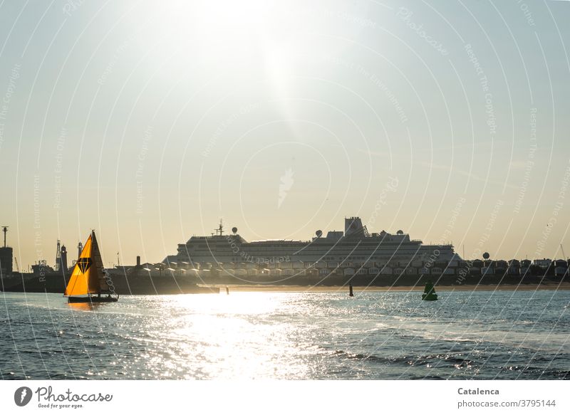 The sea, a sailing boat, starboard buoy, beach house in front of the pier, behind it a cruise ship Ocean Water North Sea Sailboat beach cottage Starboard buoy