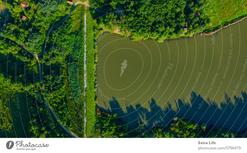 Aerial view over lake dam, weekend resort in woodland near water Above Canopy Coast Coastline Cottage Country Countryside Cultivated Cultivation Dam Dawn