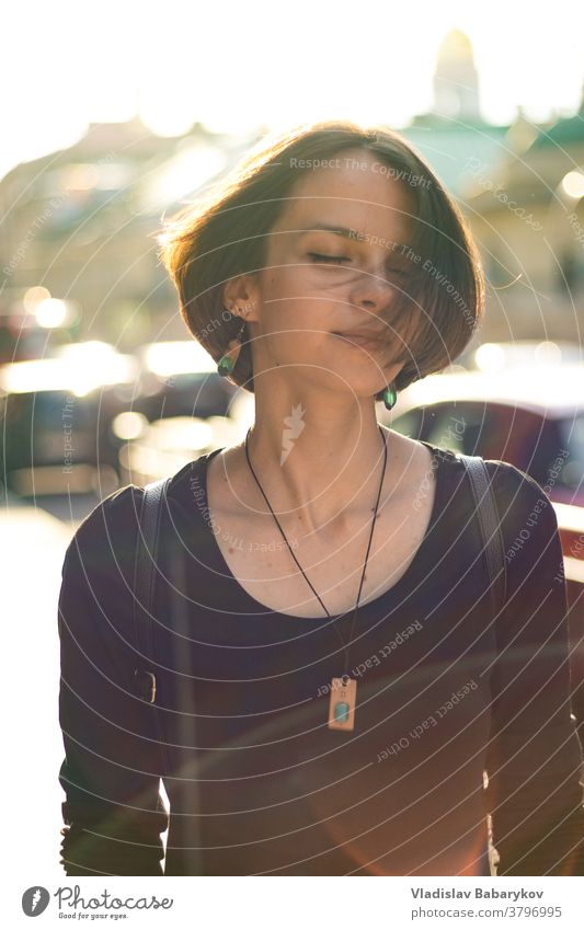 Girl shakes her head in the sunlight Glare effect Happy Sunbeam Back-light Sunlight Lens flare Day Light Blur Summer Shallow depth of field Beautiful weather