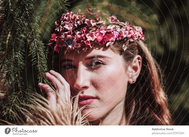 Tender young woman in flower wreath standing in forest romantic nature portrait tender charming sensual beautiful female floral style natural gentle fresh calm