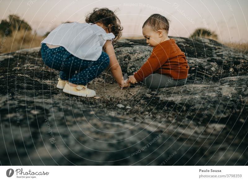 Brother and sister playing outdoors Brothers and sisters Family & Relations Authentic Autumn Autumnal colours Child Children's game childhood Childhood memory