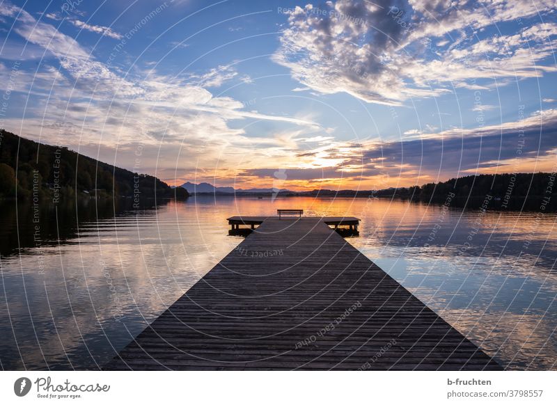 jetty at dusk Footbridge Water Lake Sunset Blue Romance Loneliness Relaxation Reflection Sky Calm Evening Landscape Lakeside Dusk Twilight Deserted Clouds