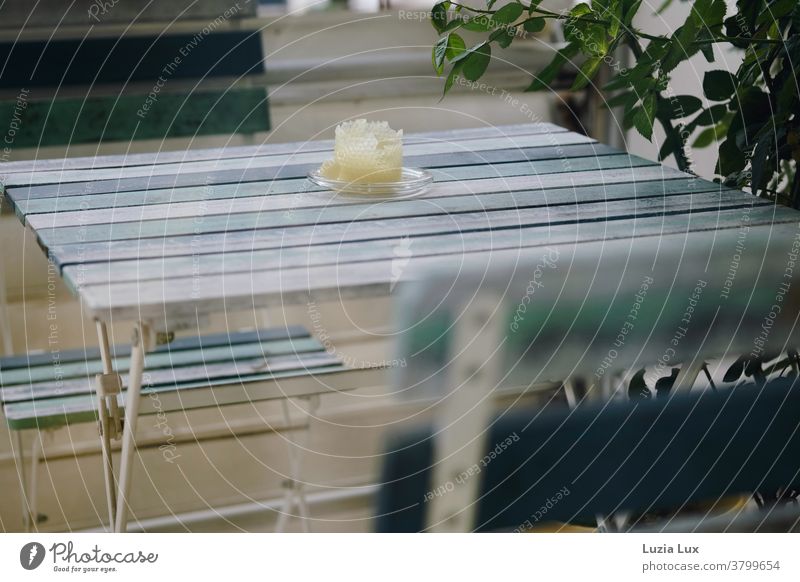 Outside on the balcony: still life with stripes, candle and sunlight Balcony balconies balcony furniture Stripe Blue Turquoise Striped shoulder stand Leaflet