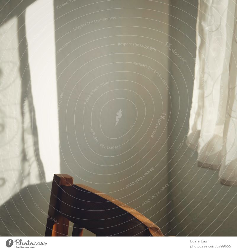 Light and shadow: A delicate curtain and its shadow on the wall opposite, in between an old-fashioned wooden chair back Drape Shadow Sunlight Window Curtain