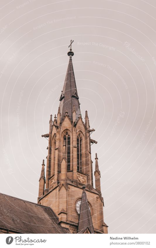 Church tower of the Herz Jesu church in Bad Kissingen in front of a thick cloud front Church spire Crucifix Religion and faith Building Clouds Christianity