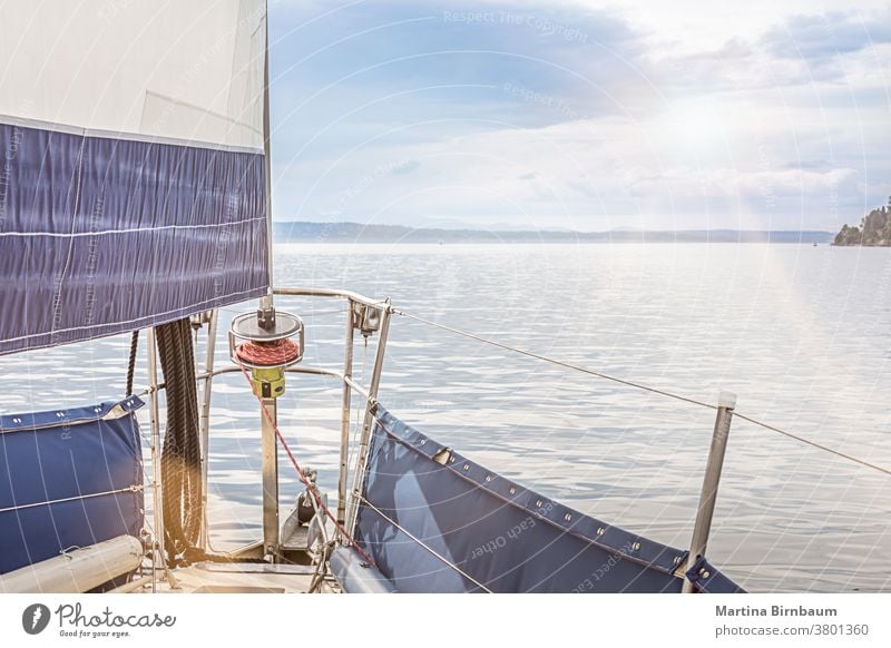 Sailing on a sailboat in the pacific ocean near Seattle, Washington sailing seattle journey cruise sport yacht sky yachting travel sunset blue horizon nautical